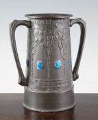 A Liberty Tudric pewter two handle vase, by David Veazey, no.010, with embossed foliage and enamel