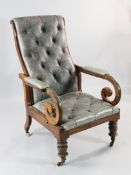 A Victorian mahogany and buttoned leather reclining chair, with scrolling arms and turned legs