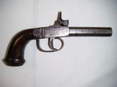 A 19th century double barrelled percussion cap pistol, with octagonal barrels floral engraved side