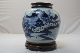 A Chinese blue and white globular jar, 18th / 19th century, painted with a pavilion in a river