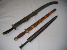 A Chinese Jian or short sword, with tortoiseshell scabbard and engraved brass mounts, 23in.,