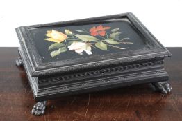 A Victorian rectangular ebonised casket, the top inset with a Derbyshire black marble and