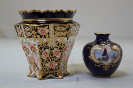 Two Royal Crown Derby vases, c.1906 and 1913, the first painted by W.Dean, with a boat at sea in a