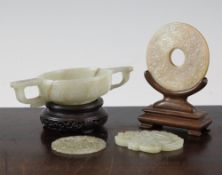 A Chinese jade cup and two jade plaques, 17th - 19th century, the mottled grey jade twin handled cup