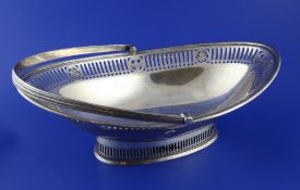 A George V silver oval cake basket by William Hutton & Sons, with engraved inscription and pierced