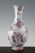 A Chinese hexagonal baluster vase, Qianlong period, painted with ribbon tied flower bouquets