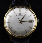 A gentleman`s gold plated and stainless steel Omega manual wind wrist watch, with baton numerals and