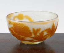 A Galle cameo glass small bowl, c.1905, the internally frosted clear glass body overlaid in orange