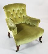 A Victorian Howard & Sons buttonback armchair, the front caps and castors marked for Howard &