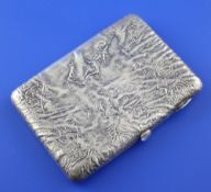 An early 20th century Russian 84 zolotnik silver cigarette case with samorodok decoration and