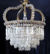 A late 19th / early 20th century gilt brass ceiling light, the four scrolling supports mounted