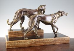 A Rochard Art Deco silvered bronze group of two hounds, on a stepped black marble and brown onyx