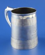 A George III silver mug, of tapering form, with two reeded bands and later engraved armorial with