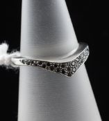 A platinum and black diamond set wishbone ring by Jeremy Hoye, size J.