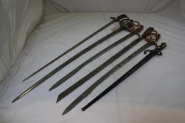 A pair of German swords, with pipe back blades, brass basket and pommel and shagreen handle grips,