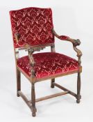 A 19th century Italian carved walnut open armchair, the scroll arms with winged head terminals and