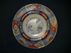 Two large Japanese Imari dishes, 19th century, the first painted with the `Three Friends of