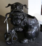 A Chinese bronze Buddhist lion censer, 19th century, grasping a cord in it`s mouth trailing to a