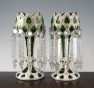 A pair of Bohemian green and white overlaid glass table lustres, late 19th century, each highlighted