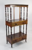 A Victorian rosewood three tier whatnot, with galleried top and two drawers, with turned uprights,
