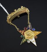 A 1950`s 9ct gold, enamel and coloured paste set presentation star brooch, with suspension bar