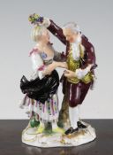 A Meissen group of a lady and gentleman dancing, 20th century, wearing 18th century dress, he