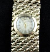 A lady`s 9ct gold Jaeger Le Coultre manual wind bracelet wrist watch, with baton numerals and mesh