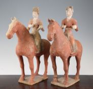 A pair of Chinese painted pottery figures on horseback, Tang Dynasty style, 36cm.