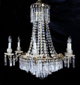 A 20th century brass and lustre hung chandelier, with six scrolling branches and four graduated