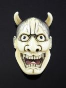 A Japanese ivory noh mask netsuke of Hannya, Meiji period, engraved three character signature, 5.