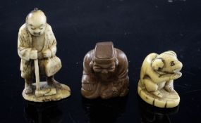 Three Japanese netsuke, 19th century, the first in stag horn carved as a woodsman, 5.5cm., the