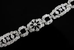 A white gold and diamond set bracelet, with openwork and cluster links, 6.5in.