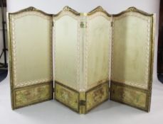 A Louis XVI style carved giltwood low four fold screen, the beige panels with embroidered silk