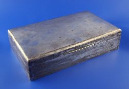 A large George V silver cigarette/cigar box, of rectangular form, with engine turned lid and