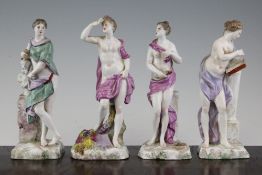 A set of four Continental faience figures emblematic of the Arts, Literature and Agriculture,