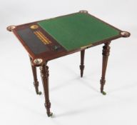 An unusual Victorian mahogany games table, the folding top opening to reveal a baize lined