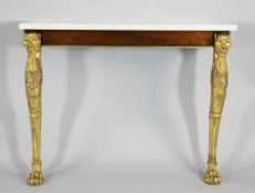 An early 19th century rosewood and parcel gilt marble top console table, with lion head monopodia