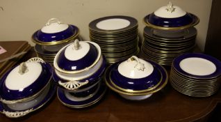 A Copeland sixty three piece part dinner service, c.1900, with cobalt blue banded and gilt decorated