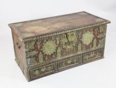 A 19th century teak and brass mounted zanzibar chest, with hinged lid and three base drawers and