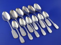 A set of six Victorian silver fiddle pattern table spoons and a set of six William IV silver dessert