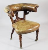 A William IV mahogany and brown leather reading chair, with brass studded upholstered back and