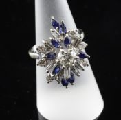 An 18ct white gold, sapphire and diamond set free form cluster dress ring, size N.
