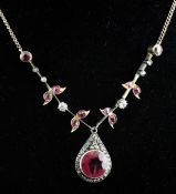 A 1940`s gold and silver, synthetic ruby and diamond drop pendant necklace, with foliate links and