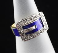 A 1970`s 18ct gold, diamond and blue enamel set buckle ring, size L.