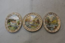 Three Royal Crown Derby topographical plaques, painted by W.E.J. Dean, with named views: Monsal