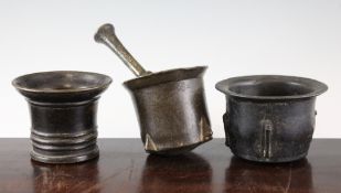 An 18th / 19th century bronze pestle and mortar, with four projecting lugs together with two other