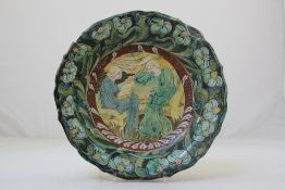 A Della Robbia pottery dish, c.1903, decorated by Cassandia Annie Walker, decorated with two