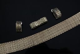 A 1950`s/1960`s suite of 9ct gold jewellery, comprising brick link bracelet, matching ring and