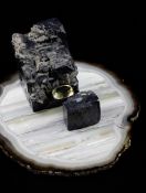 An Andrew Grima table sculpture, comprising two hematite `rock` forms united by a large citrine,