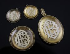 A suite of gold jewellery each with glazed monogram, comprising, pendant, brooch and pair of
